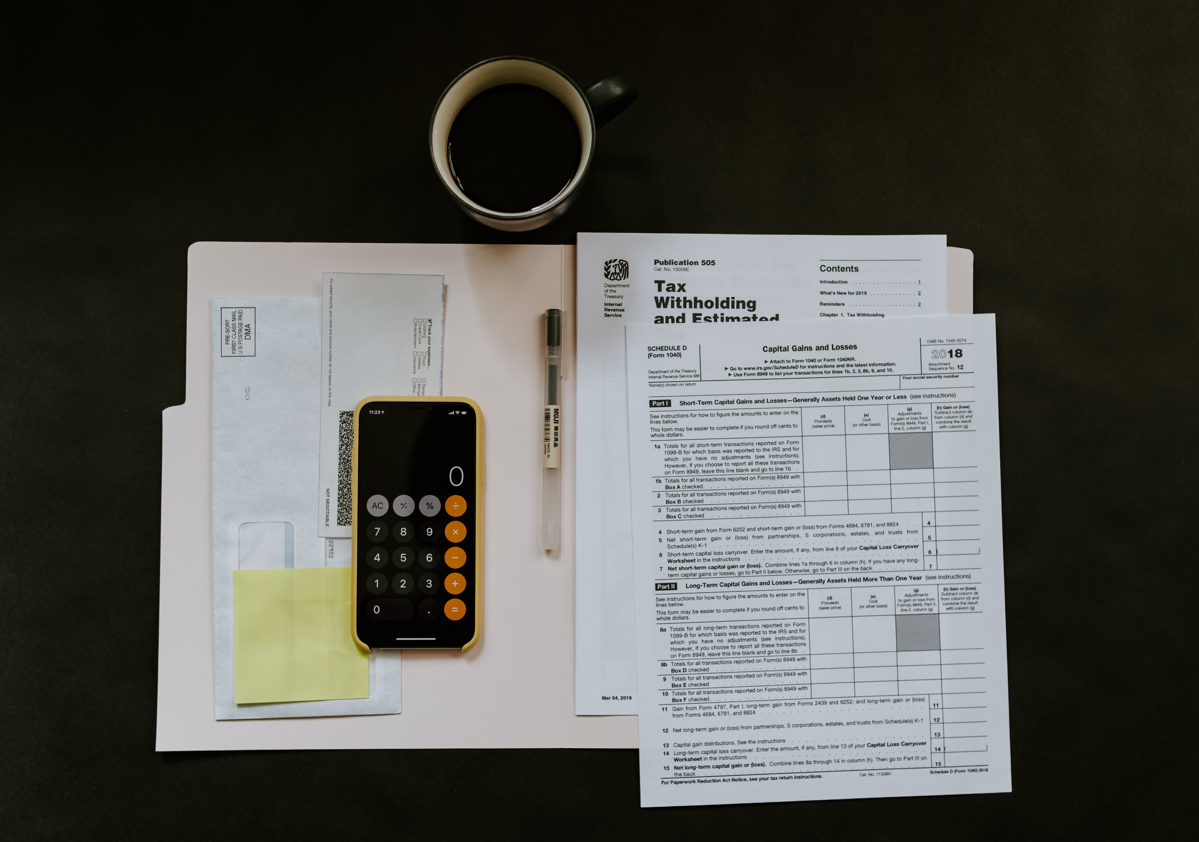 Tax form with a calculator depicting tax preparations
